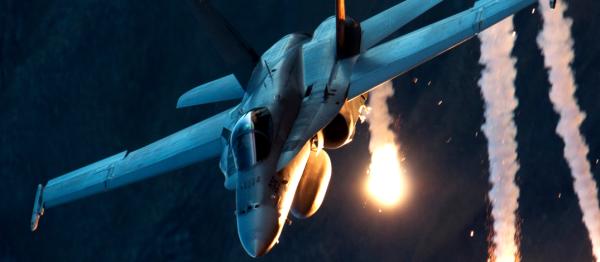 McDonnell Douglas F/A-18 Hornet deploys flares for missile defense and evasion